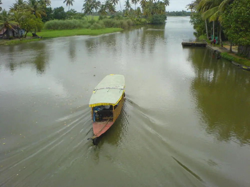 A country boat crossing a Kerala backwater, from above
